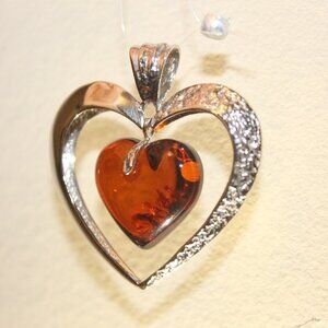Jewelry Silver (Ag 925) pendant with Baltic Amber